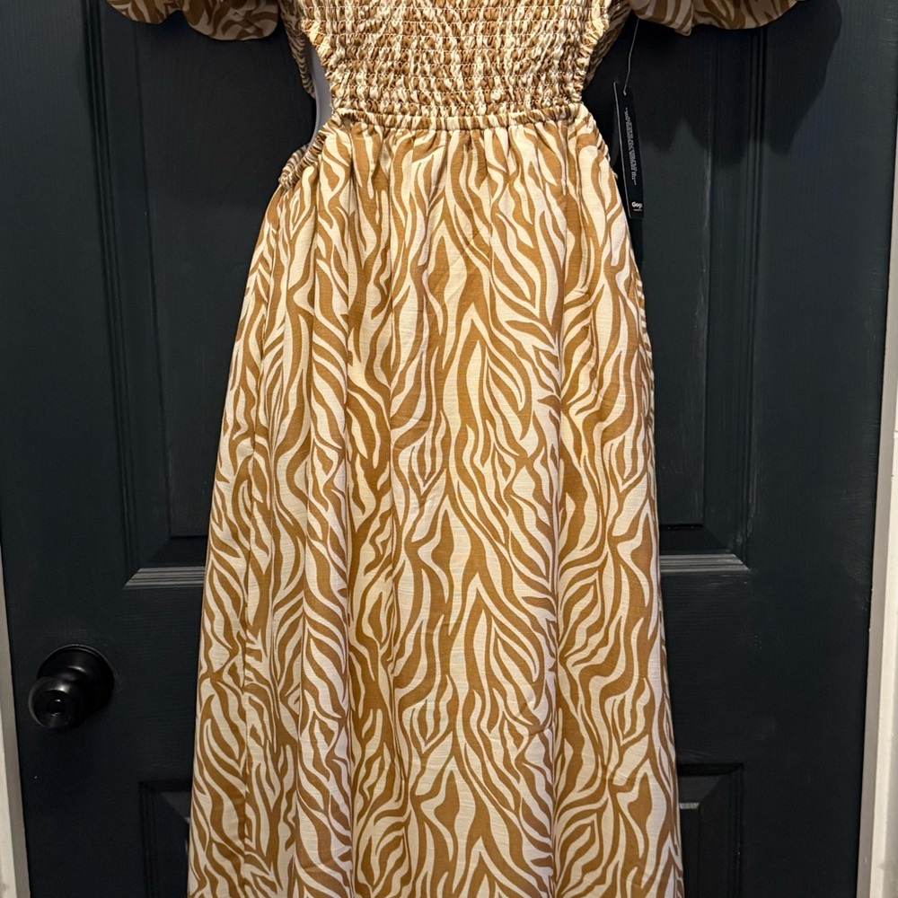 NWT- Women’s Zebra Print Off-Shoulder Dress with openings on each side.